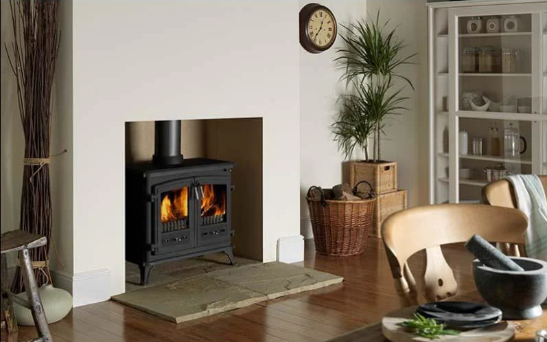 Small wood heater in a fireplace