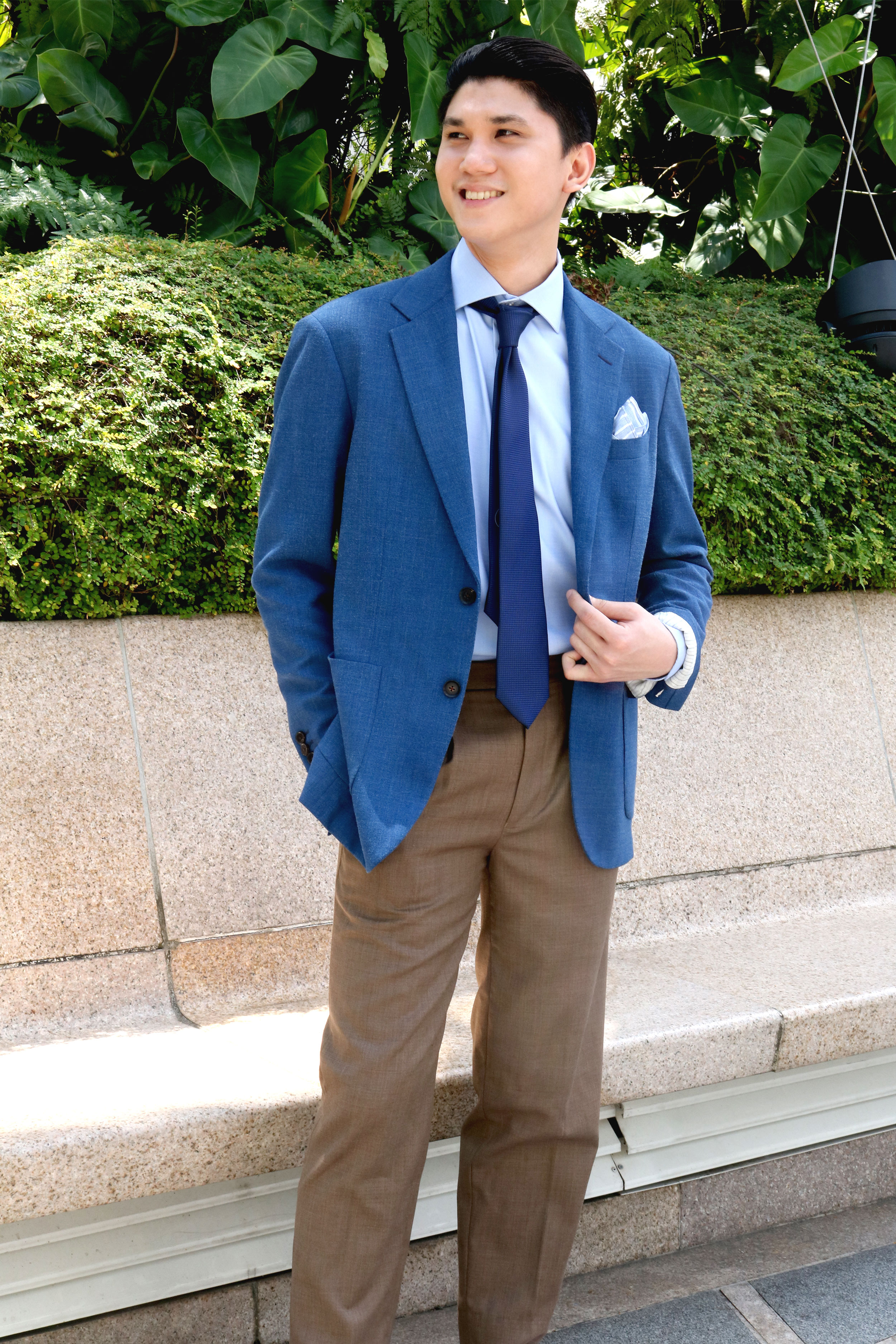 Model in Loro Piana's Tasmanian Broken Suit With Blue Business Shirt and Tie